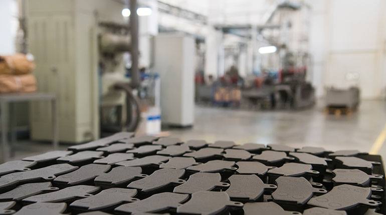 Advanced water-based release agent helps brake pad manufacturer reduce more than buildup